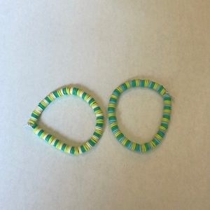 Two handmade green bracelets.